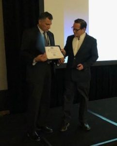 Alex Trevino receiving an award at the Mexico Technology Conference 2019